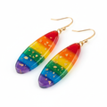Handmade rainbow resin drop earrings with all six Pride colors and gold foil accents