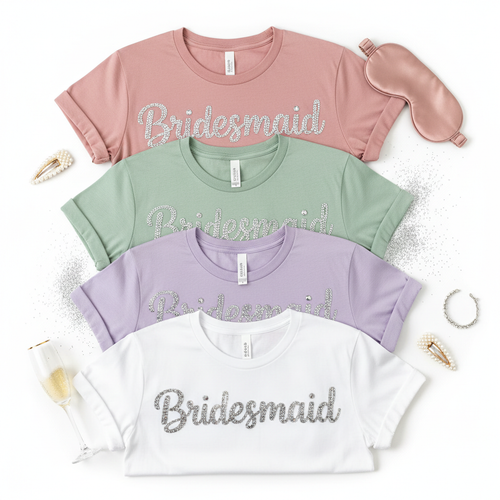 Custom bridesmaid graphic tee with rhinestone and glitter role title lettering in dusty rose, sage and lavender
