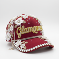 Custom junk hat in red with floral and rhinestone embellishments and gold script name